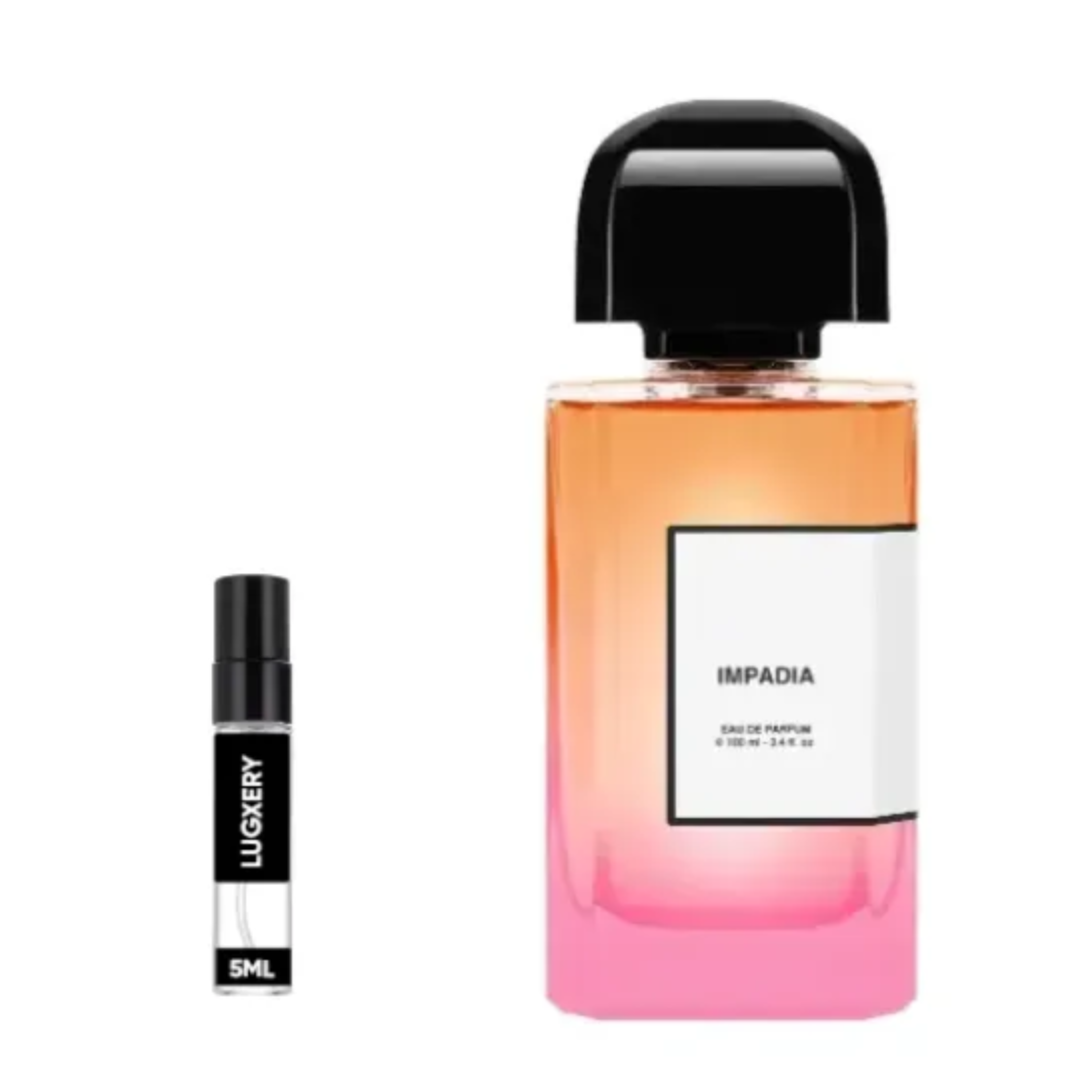 Two perfume bottles, one larger with a gradient design and black cap, the other smaller with black cap and visible brand name, on a white background.