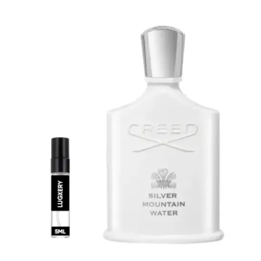 Creed Silver Mountain Water perfume bottle with a smaller black and white bottle labeled 'Lugery' on a white background.