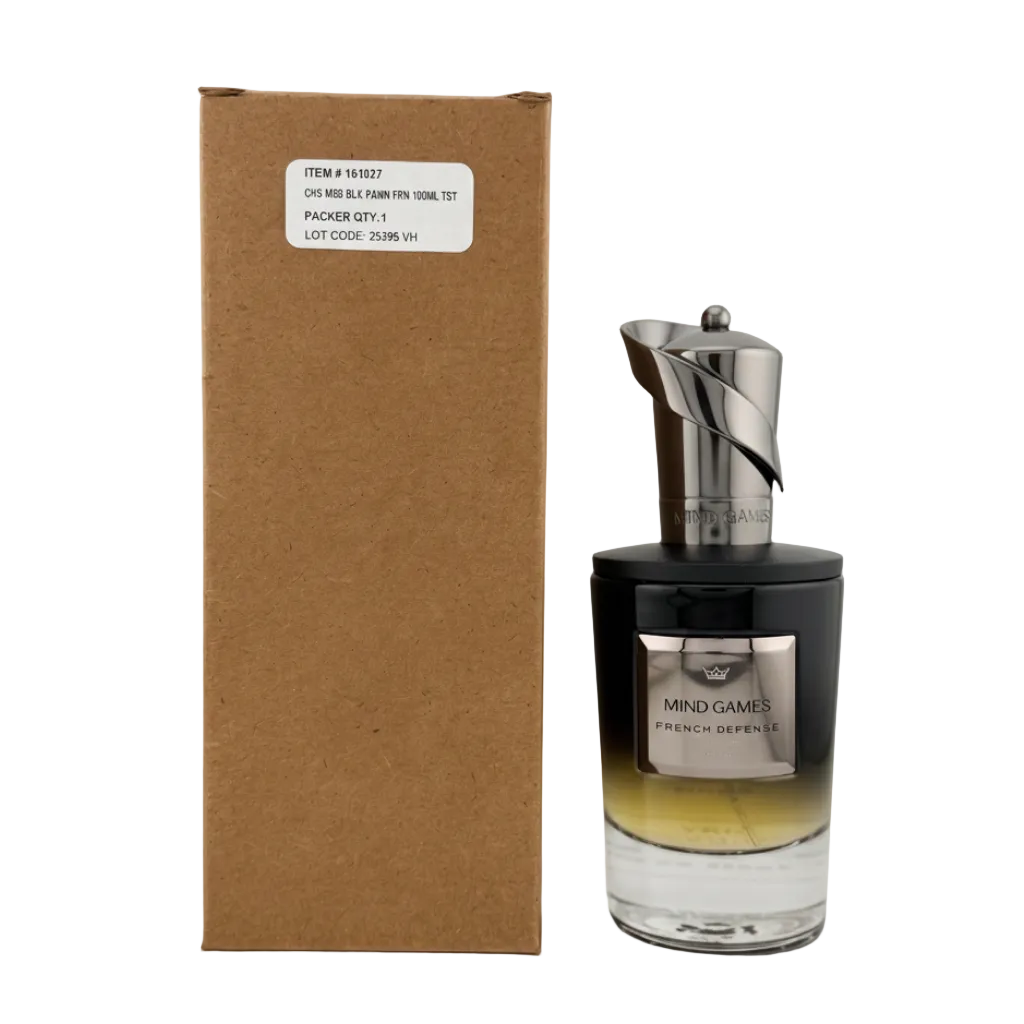 A bottle of Mind Games French Defence perfume next to its brown cardboard box, featuring a black and gold gradient bottle with a metallic silver cap.