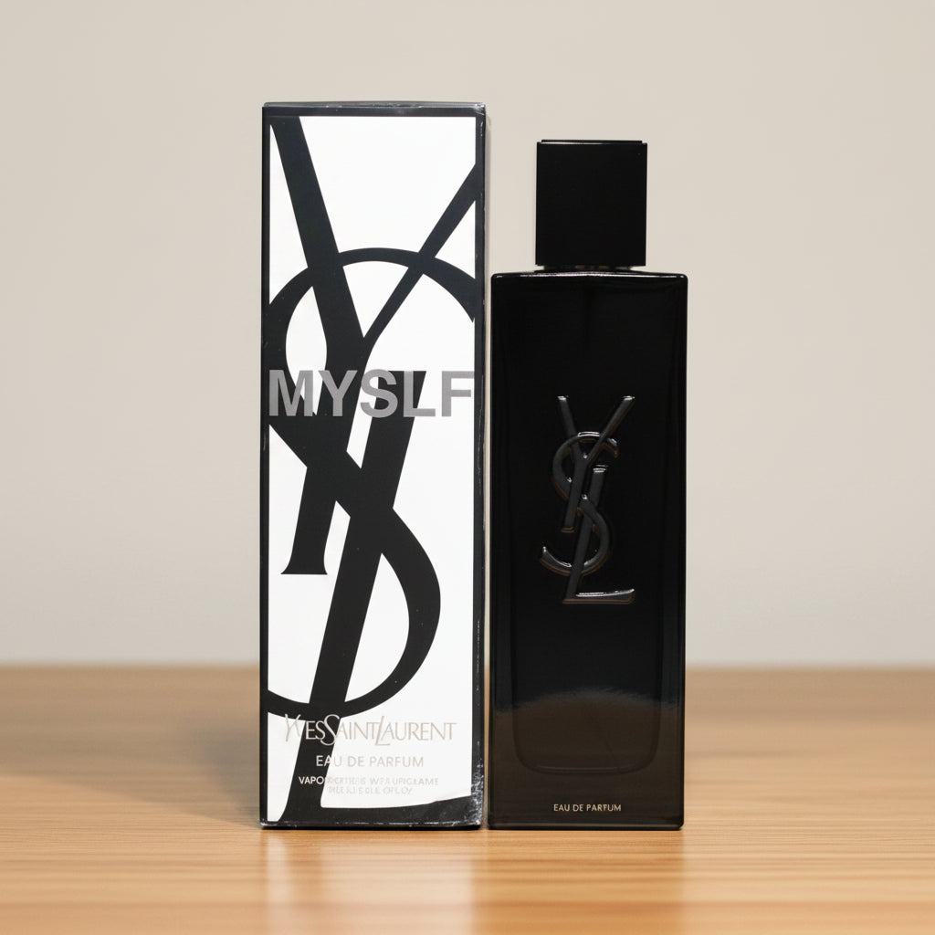 YSL Libre Eau de Parfum bottle and its matching box, both in black and white with the iconic YSL logo, on a white background.
