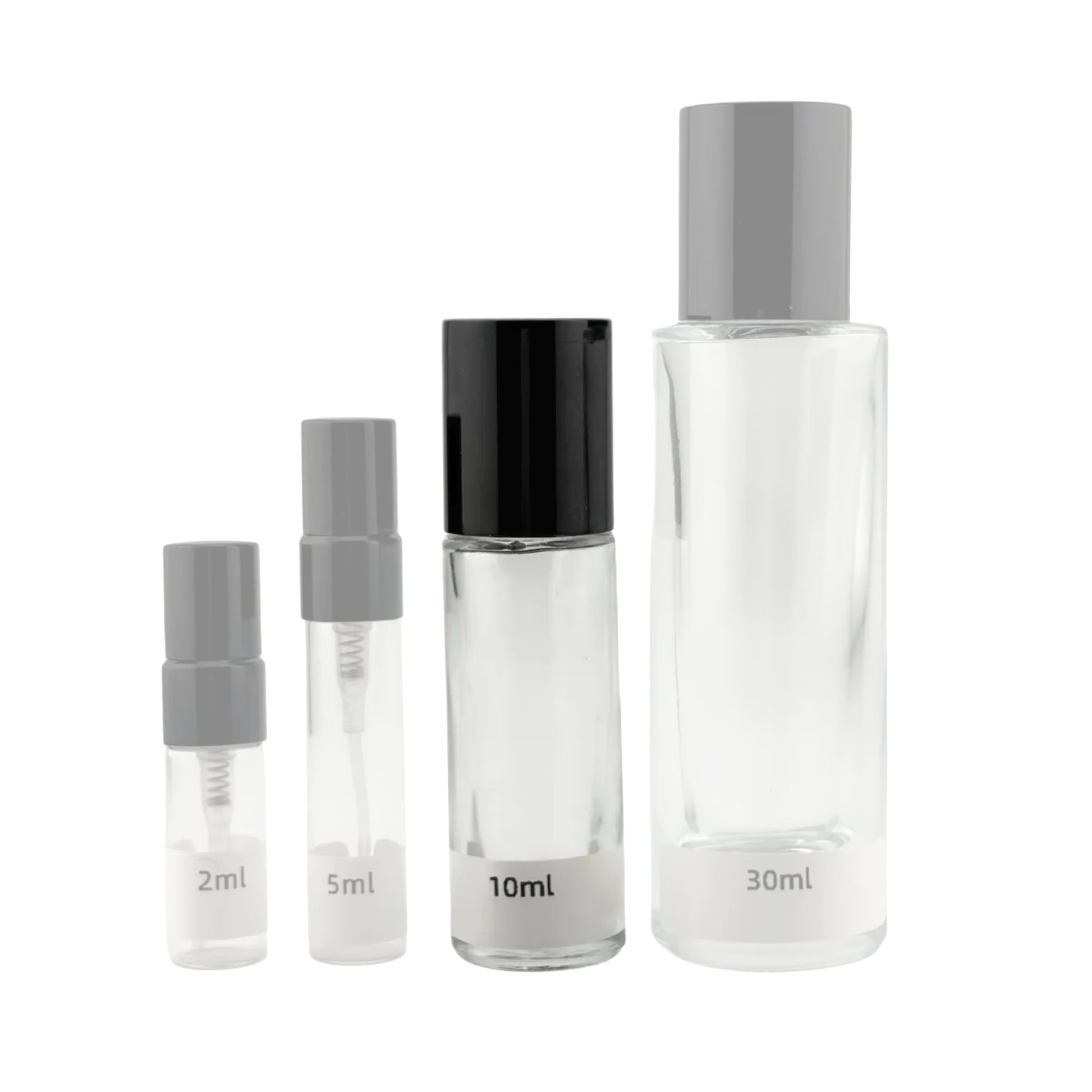 Set of clear glass bottles with gray and black caps on a white background