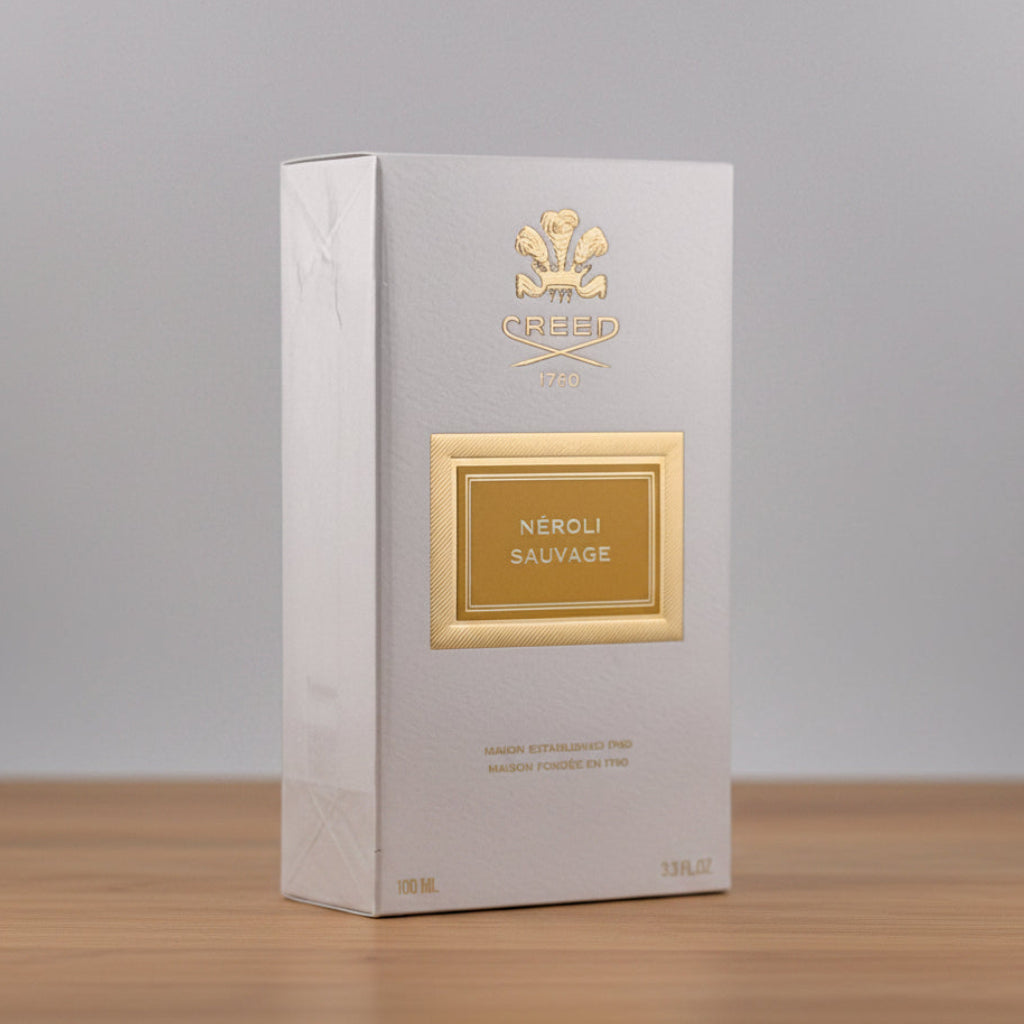Perfume box labeled 'Nérolá Sauvage' on a gray background