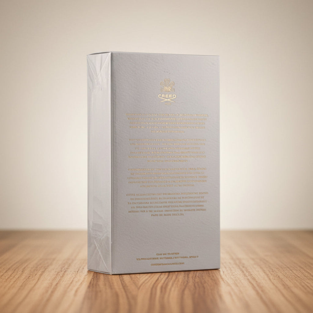 Creed Neroli Sauvage Silver box with gold text on a gray background