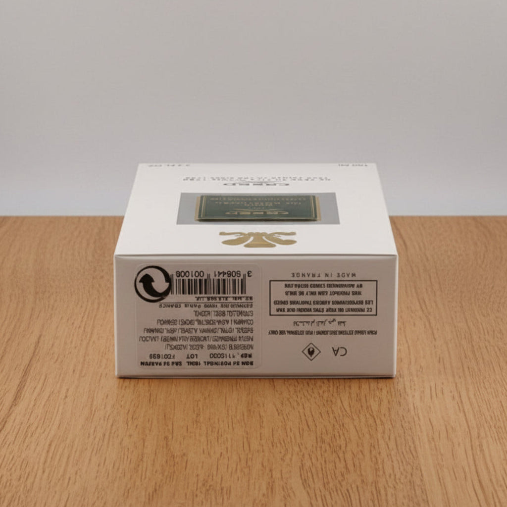 Creed Bois du Portugal. Product packaging box with branding and text on a gray background