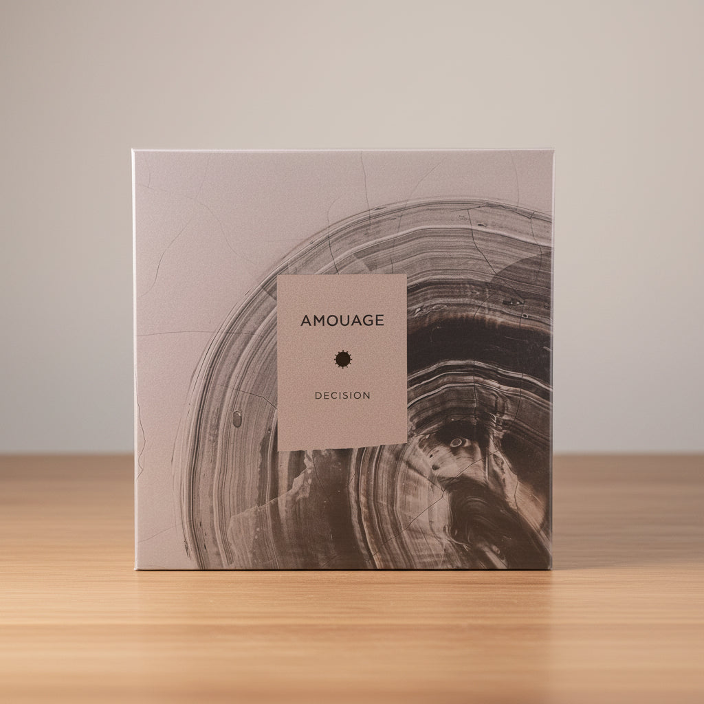 Amouage 'Decision' perfume packaging on a light gray background