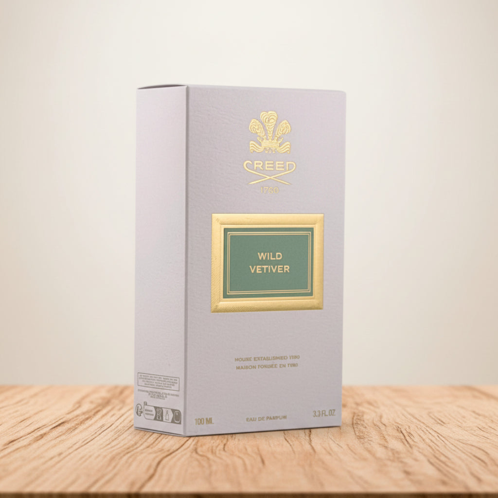 Creed Wild Vetiver perfume packaging on a gray background