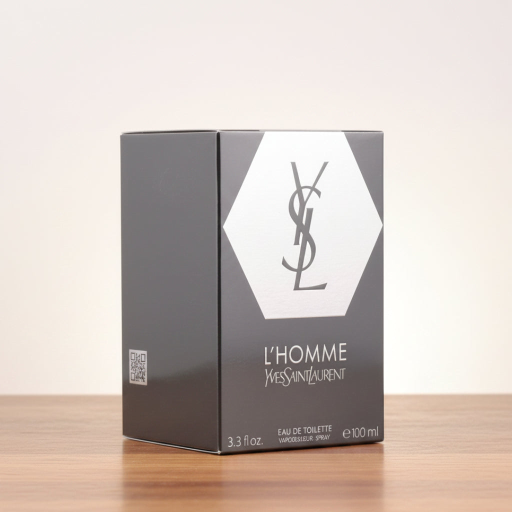 Yves Saint Laurent L'Homme Eau de Toilette 100ml box packaging, featuring a dark gray and white design with the iconic YSL logo.