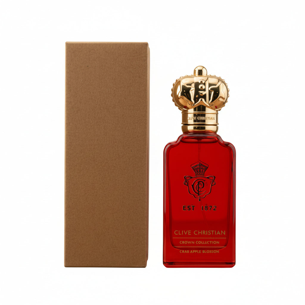 A bottle of Clive Christian Crown Collection Crème Apple Blossom Eau de Parfum next to its brown cardboard box, set against a light gray background.