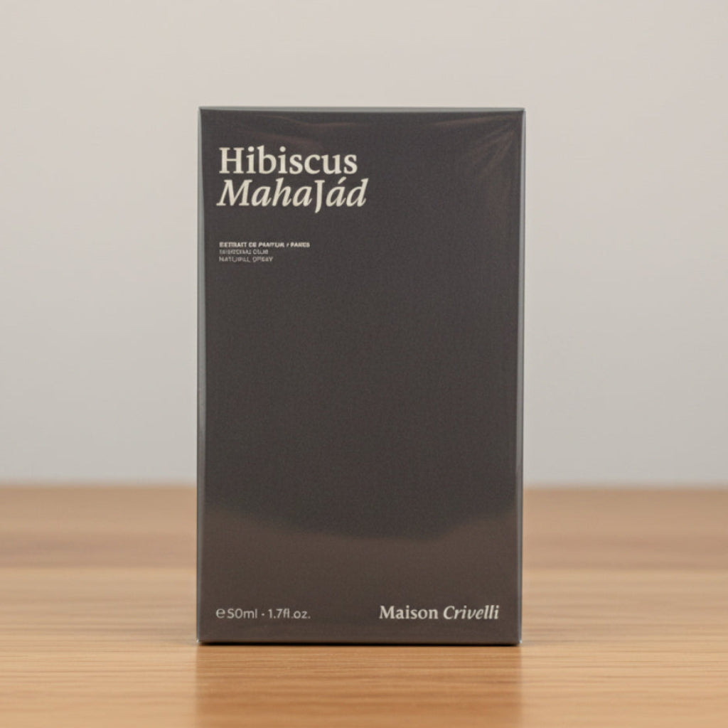 Maison Crivelli Hibiscus Mahajád perfume box in black with white text, standing upright on a white surface against a white background.