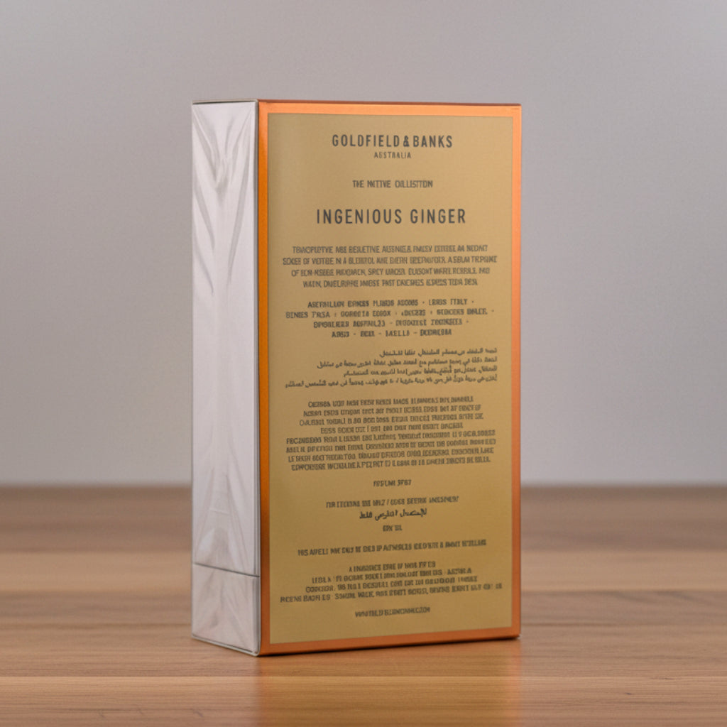 A rectangular Goldfield Brands Ingenious Ginger box, showing the back panel with text, resting on a white surface against a light gray background.