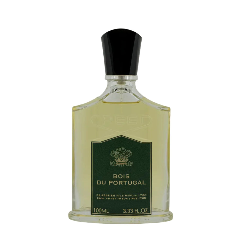 A 100ml bottle of Creed Bois Du Portugal perfume, featuring a clear glass bottle filled with pale yellow liquid, a dark green label with gold lettering, and a black cap, set against a plain light gray background.