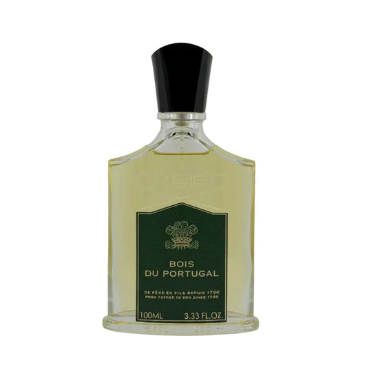 A 100ml bottle of Creed Bois Du Portugal perfume, featuring a clear glass bottle filled with pale yellow liquid, a dark green label with gold lettering, and a black cap, set against a plain light gray background.