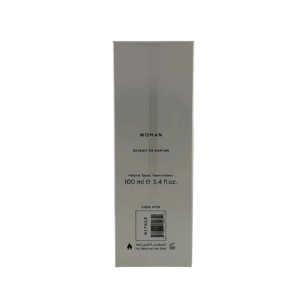 A tall, narrow white rectangular box for a perfume, labeled 'WOMAN EXTRAIT DE PARFUM' with '100 ml e 3.4 fl.