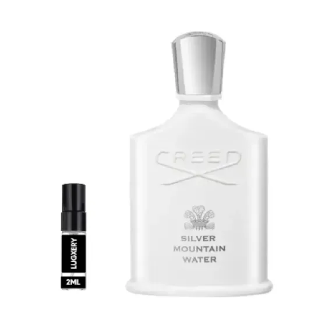 Creed Silver Mountain Water perfume bottle with a smaller black and white sample bottle on a white background