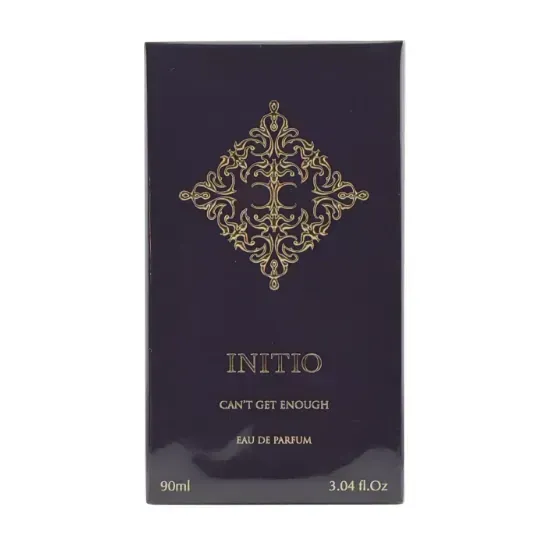 Perfume packaging with 'Initio' branding and decorative design on a dark background