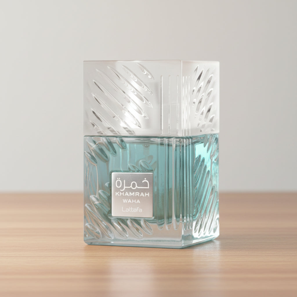 Blue glass perfume bottle with 'Khamrah Waha' and 'Lattafa' branding on a white background