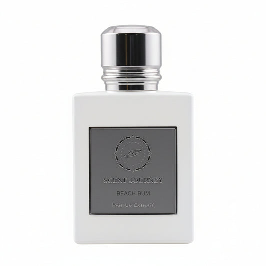 A rectangular glass perfume bottle with a metallic silver cap and a dark gray front label reading 'SCENT JOURNEY BEACH BUM' and 'PARFUM CARATAY'.