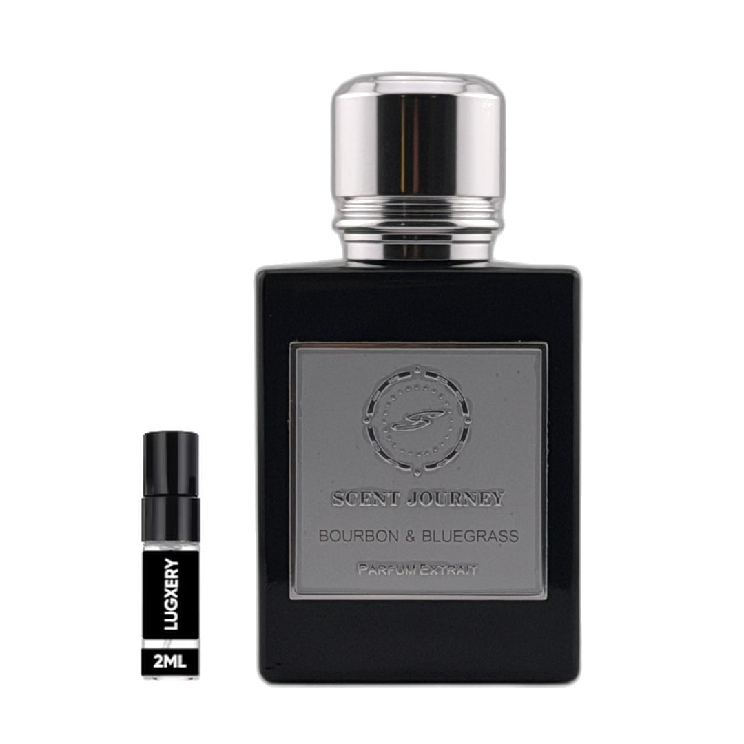 A black rectangular perfume bottle with a silver cap and a silver front label reading 'SCENT JOURNEY BOURBON & BLUEGRASS' is shown beside a small black 2ml sample spray vial labeled 'LUXURY' on a plain white background.