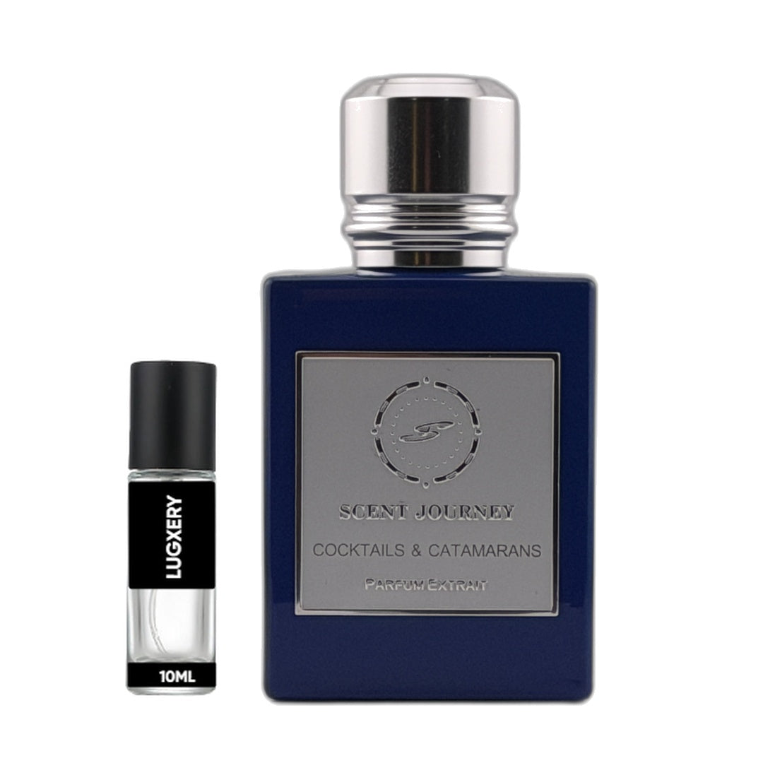 A bottle of Scent Journey Cocktails & Catamarans fragrance next to a 10ml travel spray vial. The main bottle is deep navy blue with a silver metallic cap and a silver label.