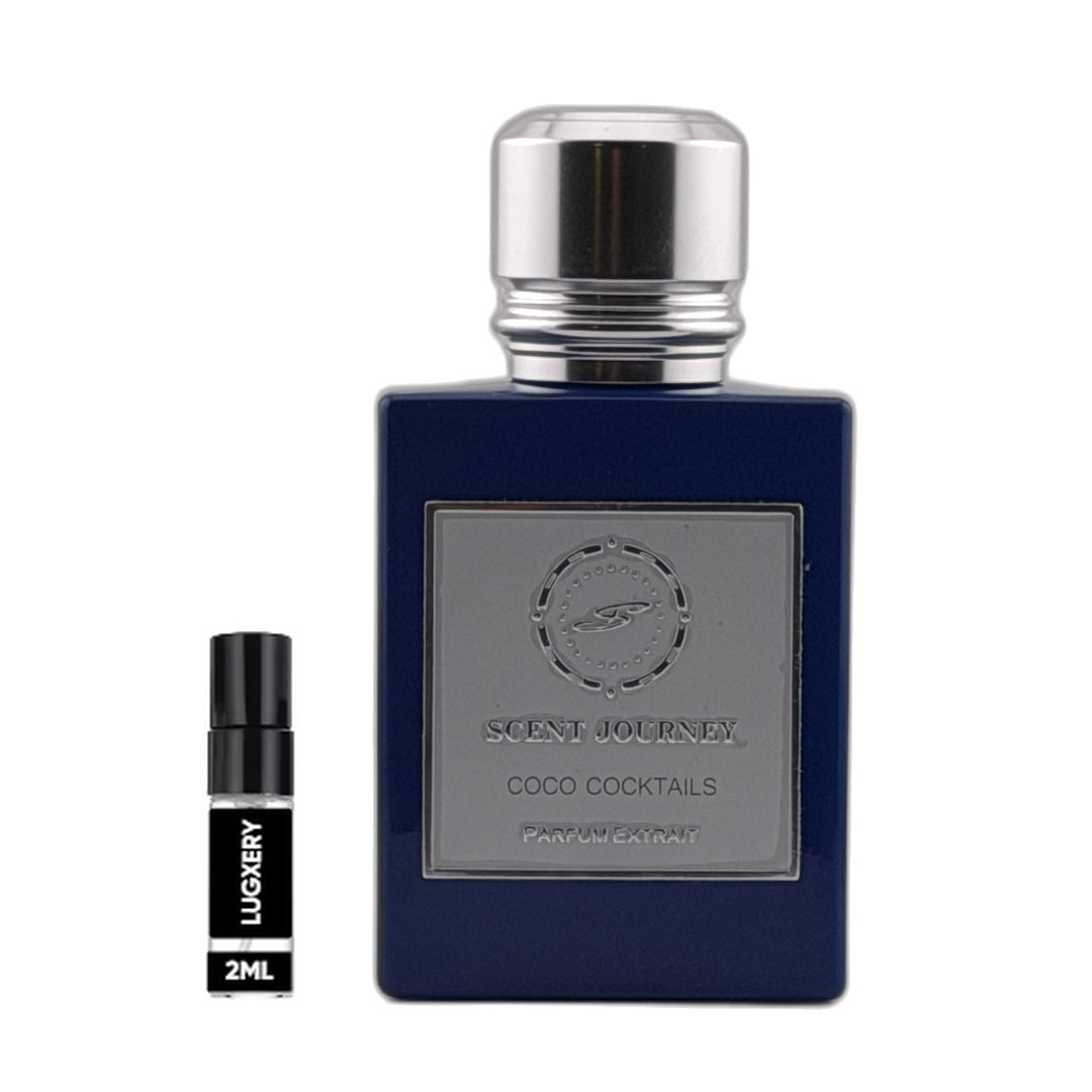 A dark blue rectangular perfume bottle with a silver cap and a silver front label reading 'SCENT JOURNEY COCO COCKTAILS' is shown beside a small black 2ml sample spray vial labeled 'LUXERY' on a plain white background.