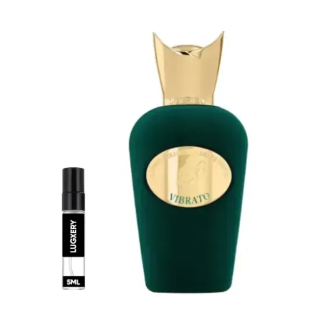 Green perfume bottle with gold cap and smaller black and white bottle labeled 'LUXERY' on a white background