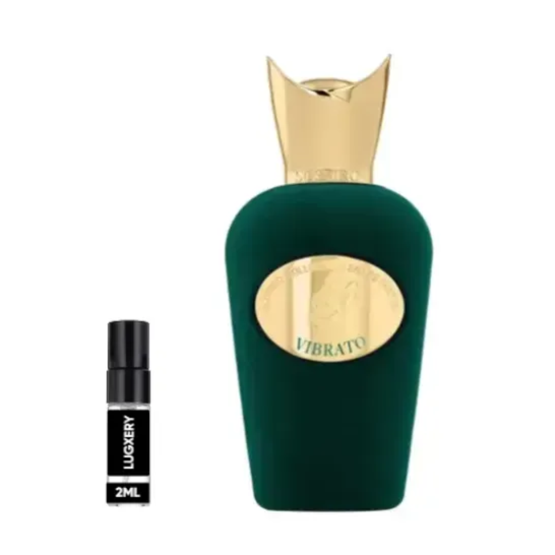 Green perfume bottle with gold cap and smaller black and gold bottle labeled 'Vibrato' on a white background